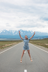 Image showing Woman sitting on the road