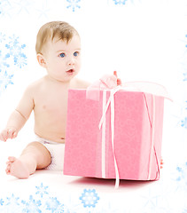 Image showing baby boy in diaper with big gift box
