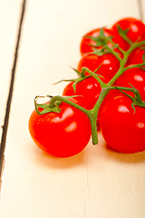 Image showing fresh cherry tomatoes on a cluster