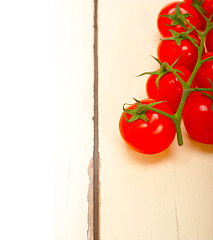 Image showing fresh cherry tomatoes on a cluster