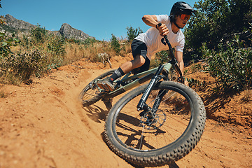 Image showing Fitness, speed and extreme sports with man on mountain bike for adventure, cycling and adrenaline junkie. Exercise, risk and fast with male athlete in nature for workout, training and action