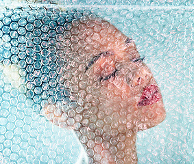 Image showing Beauty, plastic and makeup with black woman and bubble wrap for package, creative and cosmetics. Self care, confidence and youth with girl model and red lipstick for facial, art and glow in studio