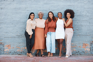 Image showing Portrait, group and business women smile standing on brick wall with mockup outdoors in city. Cooperation, teamwork hug and diversity, collaboration and friends, people and employees with happiness.