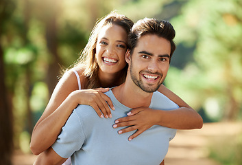 Image showing Couple in nature, piggy back in portrait and happy relationship, love and trust with travel and adventure outside People in forest, outdoor and happiness together with smile, commitment and hug