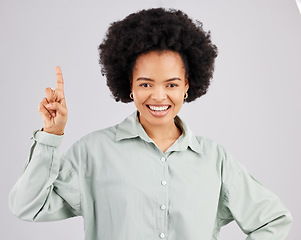 Image showing Woman portrait, up direction and idea hand sign with a smile in a studio with a solution to a question. Isolated, white background and female feeling happy and confident from inspiration and ideas