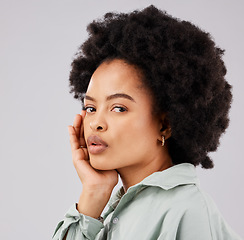 Image showing Beautiful, serious and portrait of a black woman with an afro isolated on a white background in a studio. Skincare, calm and face of an African girl with a glow, looking confident and relaxed