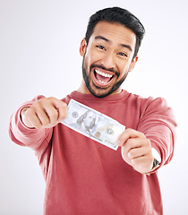 Image showing Dollar, money and excited portrait of man on studio background for investment, financial savings and payment. Finance profit, winner and happy male for winning, cash bonus and stock market success