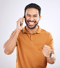 Image showing Phone call communication, portrait and happy man celebrate achievement, success news or studio winning. Excited, winner or male celebration fist pump, announcement or notification on white background