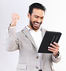 Image showing Tablet, news and business man celebrate achievement, success goals or reading winning announcement. Excited, studio winner and happy male fist pump, victory or salary notification on white background