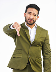 Image showing Thumbs down, business man and sad portrait in a studio with bad feedback, voting and emoji hand sign. Negative opinion, decision and wrong hands gesture of a upset male with isolated white background