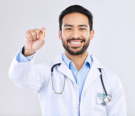 Image showing Pharmacist portrait, studio pills or happy man with pharmaceuticals, drugs or medicine supplement. Healthcare support, medical pharmacy or male doctor with prescription medication on white background