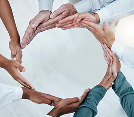 Image showing Teamwork, collaboration and hands of business people in circle for motivation, support and community in office. Diversity, success and top view of men and women palms for goals, trust and solidarity