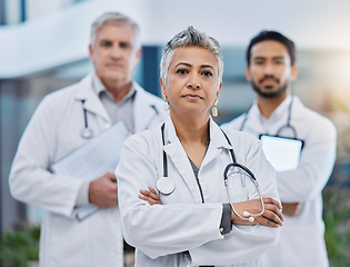 Image showing Senior woman, doctor team portrait and leadership outdoor feeling serious with vision. Healthcare, wellness and professional group with arms crossed and vision ready for medical and clinic teamwork