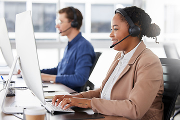 Image showing Black woman, call center and typing on computer, smile in office and working on customer service in workplace. Telemarketing, desktop and happiness of person, female sales agent or consultant writing