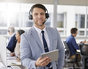 Image showing Man, call center and tablet with smile in portrait, typing and crm for customer service, tech support or help. Male consultant, agent or contact us with happiness in workplace with mobile touchscreen