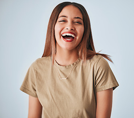 Image showing Happy, laughing and portrait of a cheerful woman isolated on a white background in studio. Smile, funny and a beautiful young girl with happiness, smiling and positivity on a backdrop for expression