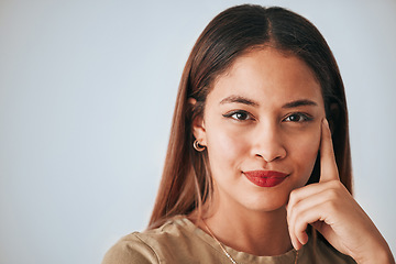 Image showing Thinking, woman portrait and happy face closeup of a young female with decision and mockup. Isolated, studio background and contemplation person with creative strategy idea feeling thoughtful