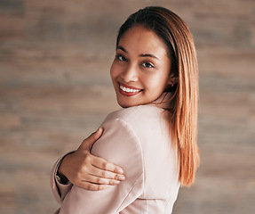 Image showing Happy, beautiful and portrait of a woman on a wall at work with confidence, happiness and pride. Smile, content and executive employee working in corporate, professional business and management