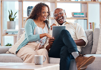 Image showing Mature couple, tablet and sofa for laugh in living room with bond, love or video on app for memory. Black man, woman and mobile touchscreen for funny movie on web in house on lounge couch to relax