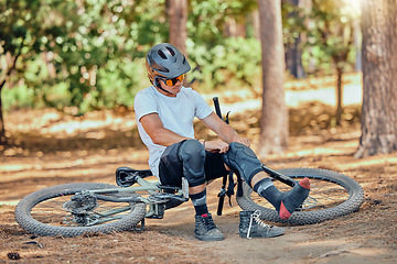 Image showing Man, bicycle and knee pad for protection with cycling, dirt or nature in summer in extreme sport preparation. Mountain bike, cyclist or safety for exercise, workout or training for triathlon in woods