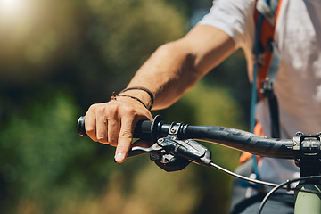 Image showing Mountain bike, cyclist hand and brake outdoor in nature in sunshine for safety, extreme sport or lens flare. Man, bicycle and marathon challenge for fast workout, training or exercise for summer race