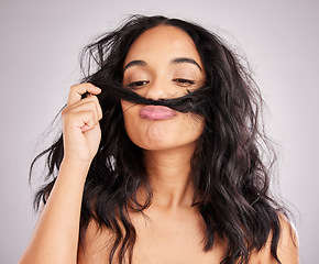 Image showing Beauty, salon and woman smell hair, aesthetic and cosmetics on a grey studio background. Female, moustache and lady with facial expression, silly and goofy with treatment, smelling clean and wellness