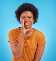 Image showing Black woman, privacy and gossip in studio, sharing exciting news or confidential drama on blue background. Deal announcement, whisper and happy African girl with afro, discussion isolated in secret.