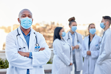 Image showing Covid, portrait and proud man doctor outside of hospital with team for planning, teamwork and strategy. Face, healthcare and male leader with doctors for innovation, brainstorm and corona management