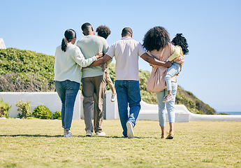 Image showing Grandparents, parents and children walking in garden for bonding, quality time and relax together. Family, love and back of happy mother, father and kids enjoy holiday, summer vacation and weekend