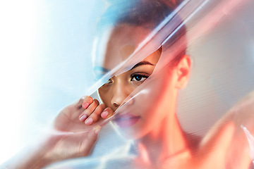 Image showing Plastic tear, makeup and face of woman with beauty products, cosmetics and skincare in studio. Creative art deco, aesthetic and eyes of girl with glow, lipstick and luxury style with neon packaging