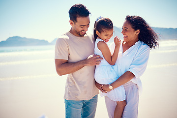 Image showing Happy family, beach smile and playing of a mother, father and girl together by the ocean. Nature, sea and love of a mom, dad and child in Philippines on vacation with parents tickle on travel holiday