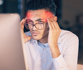 Image showing Man, headache and computer in stress, burnout or suffering pain at night by office desk. Businessman employee rubbing head or touching painful area by desktop PC feeling overworked at workplace