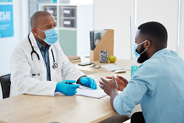 Image showing Doctor, covid consultation and black man talking with patient for checkup or results in clinic. Healthcare, medical professional and African person consulting physician for advice with clipboard.