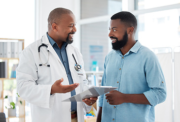 Image showing Doctor, black man and patient with clipboard in consultation, talking or health results in hospital. Healthcare, paperwork and happy medical professional with mature person with checklist in clinic.