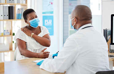 Image showing Doctor, covid and patient with shoulder pain in hospital, fibromyalgia or inflammation. Face mask, healthcare professional and black woman with injury, arthritis or painful tendinitis in consultation