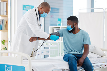 Image showing Doctor, covid and blood pressure with black man for heart health, test and examination. Face mask, hypertension and patient, medical professional and sphygmomanometer for consultation in clinic