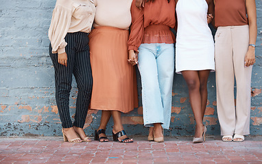 Image showing Fashion, formal and business woman legs at office against a wall in team collaboration or unity. Friends, standing and leg of professional corporate employee women in luxury outfits at workplace