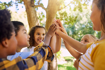 Image showing Happy, playing and children with a high five for a game, support and team building at a park. Smile, together and friends with hands for motivation, connection and celebration at a summer camp