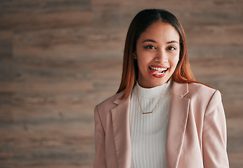 Image showing Happy, portrait and woman with her tongue out by a wall with a positive, goofy and confident mindset. Happiness, excited and headshot of a young female model fro Mexico with a silly face expression.