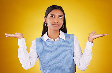 Image showing Choice, thinking and offer with woman in studio for decision, confused and option mockup. Why, show and uncertain with female holding on yellow background for product placement, doubt and results