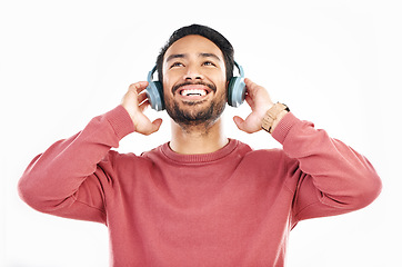 Image showing Headphones, smile and music, happy man in studio isolated on white background streaming radio and happiness. Podcast subscription, technology and song, Indian guy listening to audio online to relax.