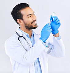 Image showing Doctor with smile, syringe and vaccine in studio for healthcare, medicine and innovation in medical science. Vaccination, booster shot in bottle and needle, health care and help with virus protection