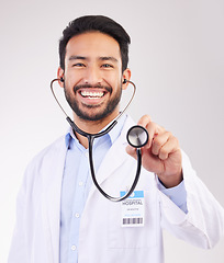 Image showing Happy asian man, doctor and portrait with stethoscope for healthcare cardiology against a white studio background. Male medical professional with smile for checkup, heart beat or life insurance