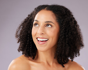 Image showing Skincare, beauty and happy woman in a studio with a self care, natural and facial treatment. Happiness, smile and female model from Mexico with a cosmetic face routine isolated by a gray background.