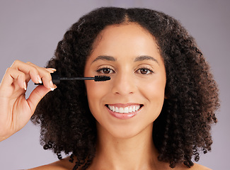 Image showing Woman, face and smile in portrait with mascara, beauty and makeup with cosmetic product on studio background. Happy female, cosmetology and eyelash extension with brush, happiness and cosmetics glow