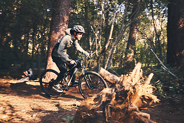 Image showing Fitness, cycling and sports with man in nature for training, adventure and workout. Strong, exercise and challenge with male cyclist riding on bike in forest park for cardio, race and speed