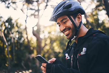 Image showing Cycling, phone and smile with man in nature for search, networking and connection. Relax, happy and social media with male cyclists in forest park for training, sports and internet browsing