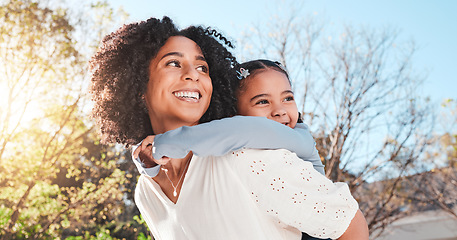 Image showing Mother, child and family outdoor with love and care for piggyback to a play game for fun in backyard. Smile of woman and girl kid in nature to relax together in summer with a hug for support or trust