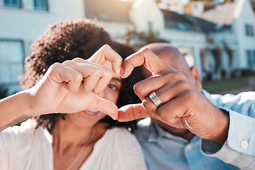 Image showing Love, couple and heart hands outside of new house, property or real estate success. Emoji, shape and woman with man in front of dream home in celebration of rental, moving or homeowner milestone