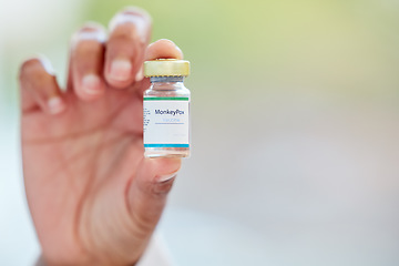 Image showing Healthcare, vaccine and hand with monkeypox treatment for cure, breakthrough and innovation on blurred background. Hands, showing and vaccination by woman doctor holding medical booster at hospital